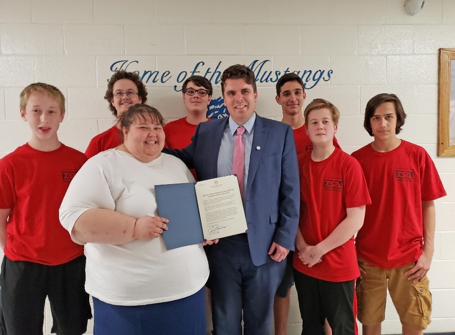 Adam Flack from Senator Manchin's office greets the students of Clay County Middle School's Technology Student Assocation