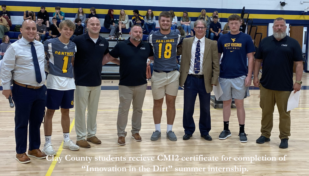CMI2 presents certificate to Clay County High School students.